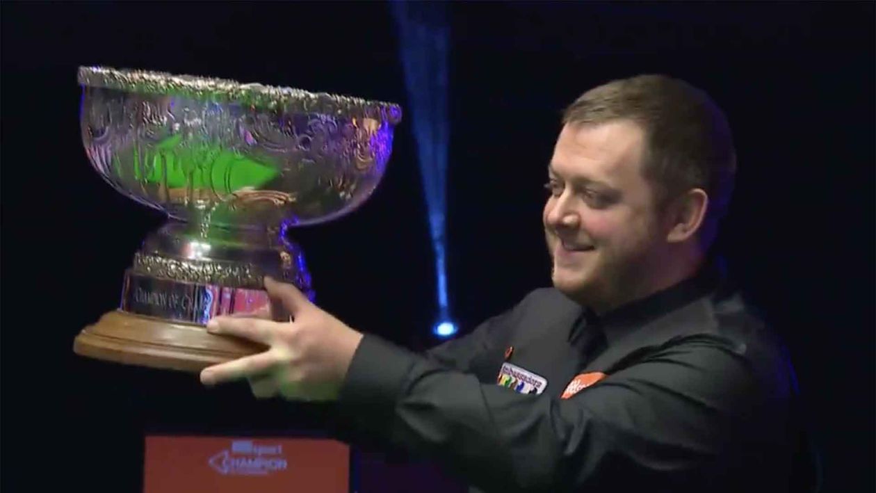 Mark Allen lifts the Champion of Champions trophy