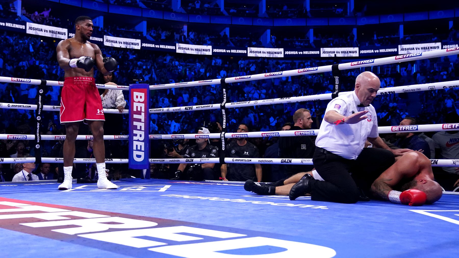 Anthony Joshua knocks out Robert Helenius and lines up Deontay Wilder next