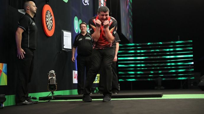 Mensur Suljovic celebrates winning the Champions League of Darts (Lawrence Lustig, PDC)