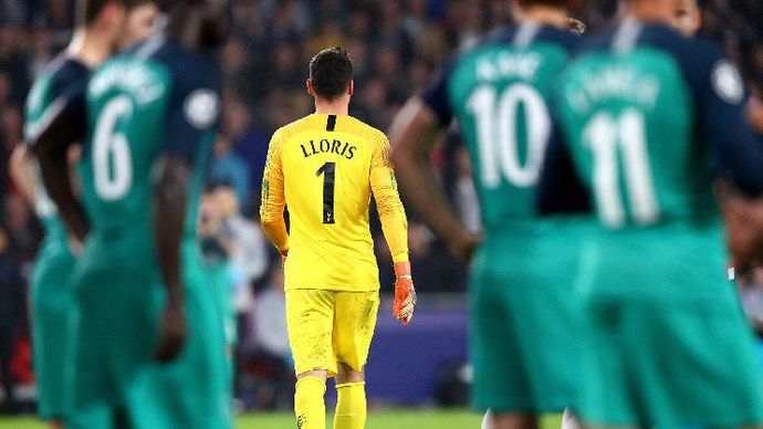 Hugo Lloris walks after seeing red for Tottenham in the Champions League