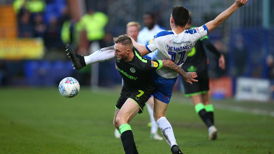 Carl Winchester (left) and Connor Jennings battle for the ball