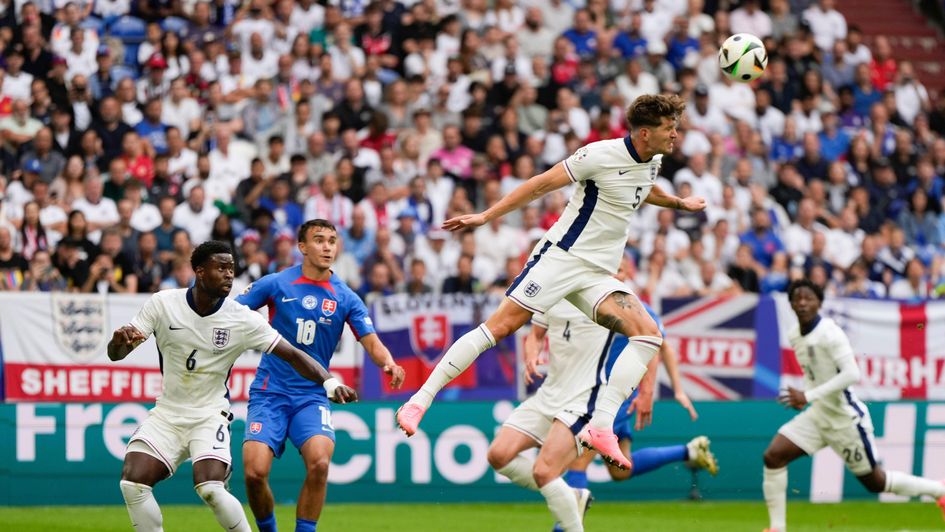 John Stones wins a header