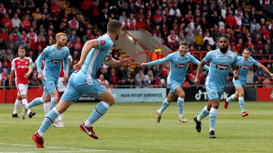 Luke Waterfall celebrates a goal against Wrexham