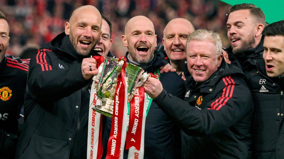 Erik ten Hag and his coaching staff with the Carabao Cup