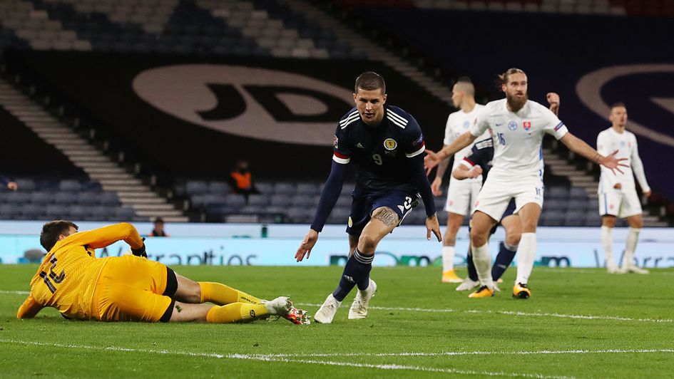 Lyndon Dykes celebrates his goal against Slovakia