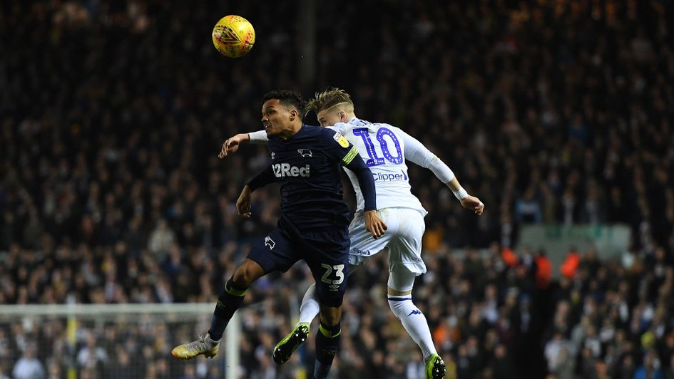 Duane Holmes and Ezgjan Alioski battle for the ball