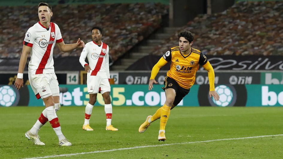 Pedro Neto checks for offside after scoring for Wolves