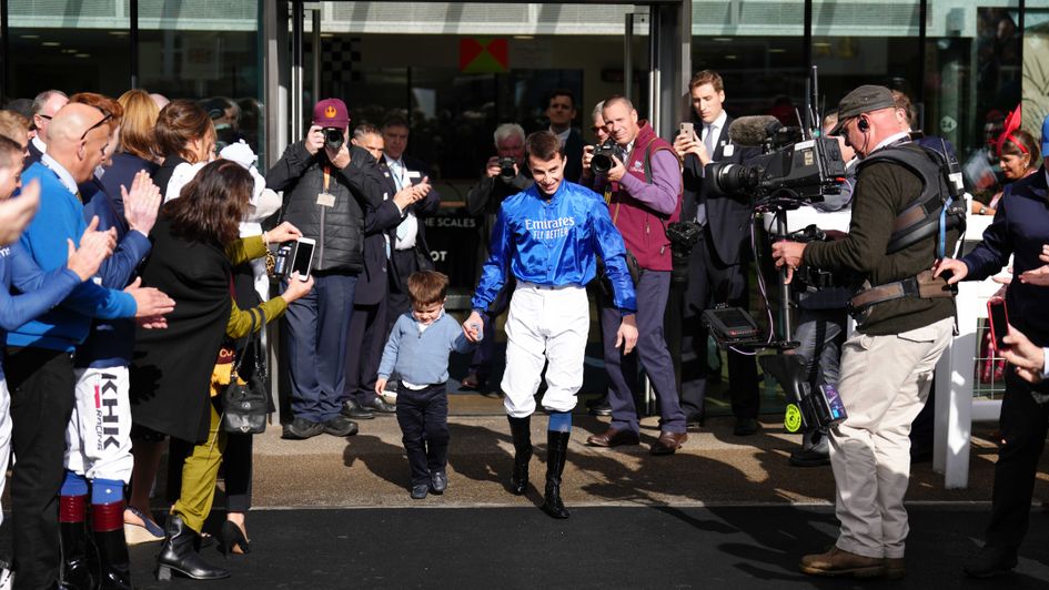 William Buick with his son before he collected his champion jockey trophy