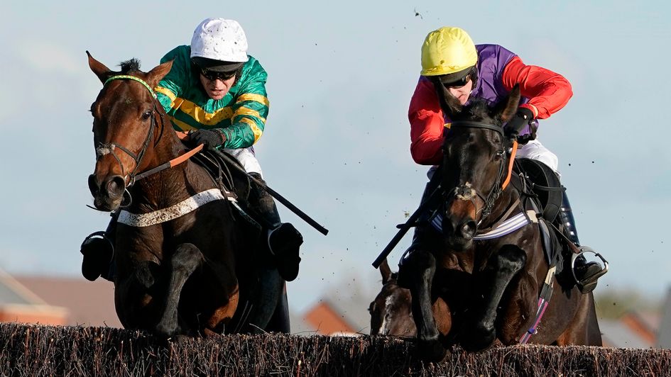 Champ jumps past Dashel Drasher at the last at Newbury