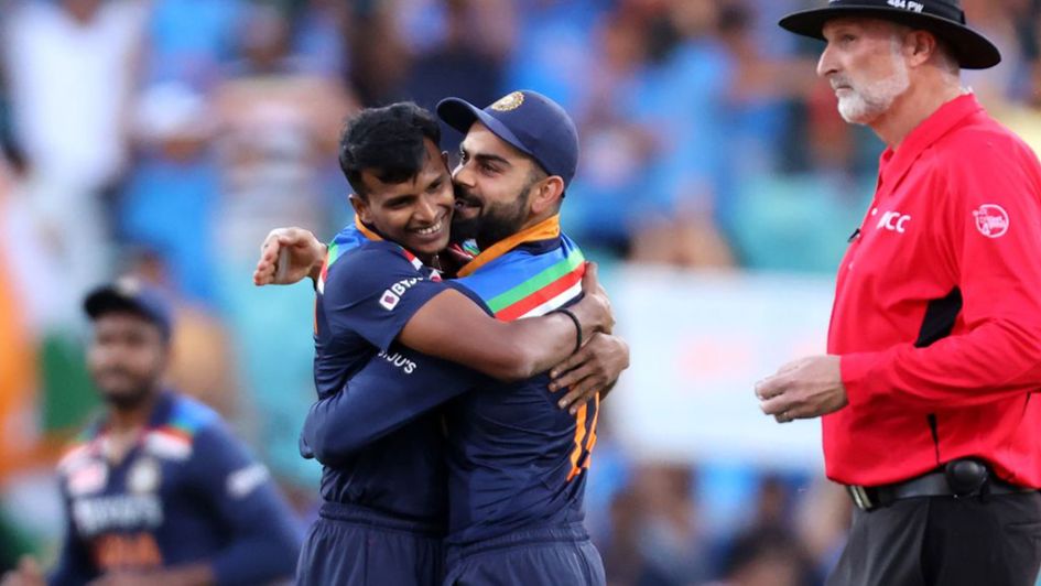 T Natarajan is embraced by India captain Virat Kohli
