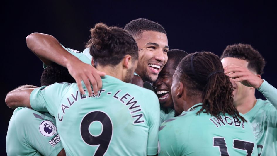 Mason Holgate is swamped by his Everton team-mates