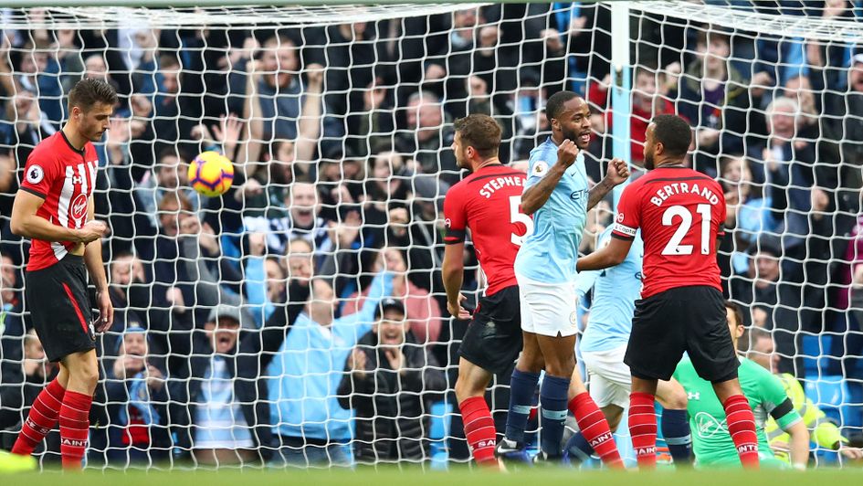 Raheem Sterling celebrates after scoring Manchester City's fourth goal