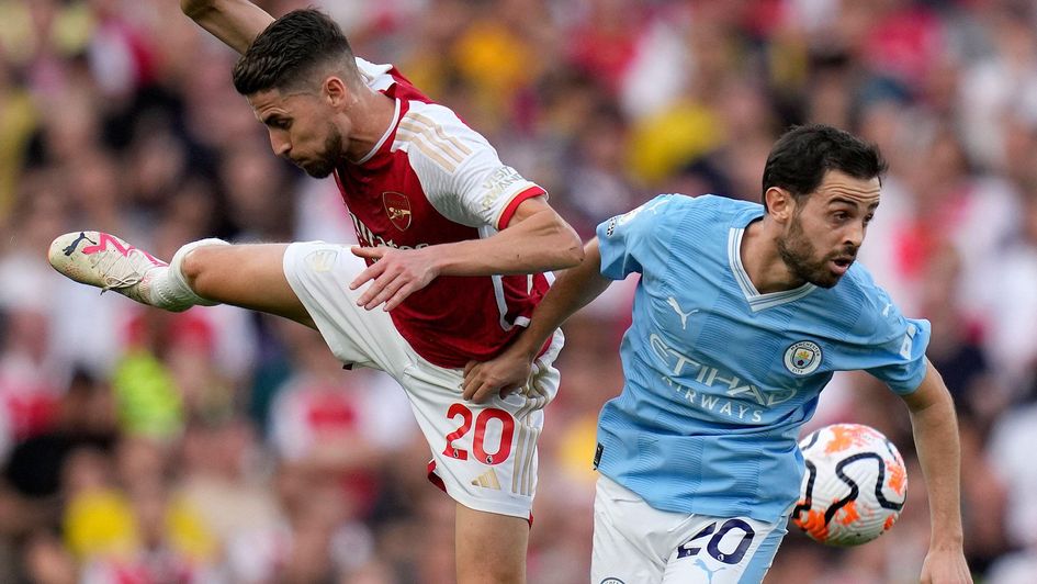 Jorginho and Bernardo Silva challenge for the ball