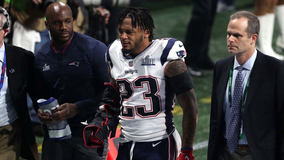 Patrick Chung leaves the field injured during the Super Bowl