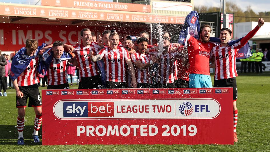 Lincoln celebrate following their promotion from Sky Bet League Two