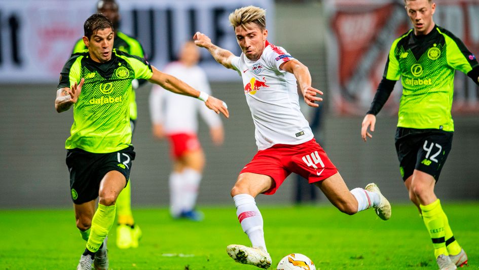 Kevin Kampl (R) and Cristian Gamboa vie for the ball