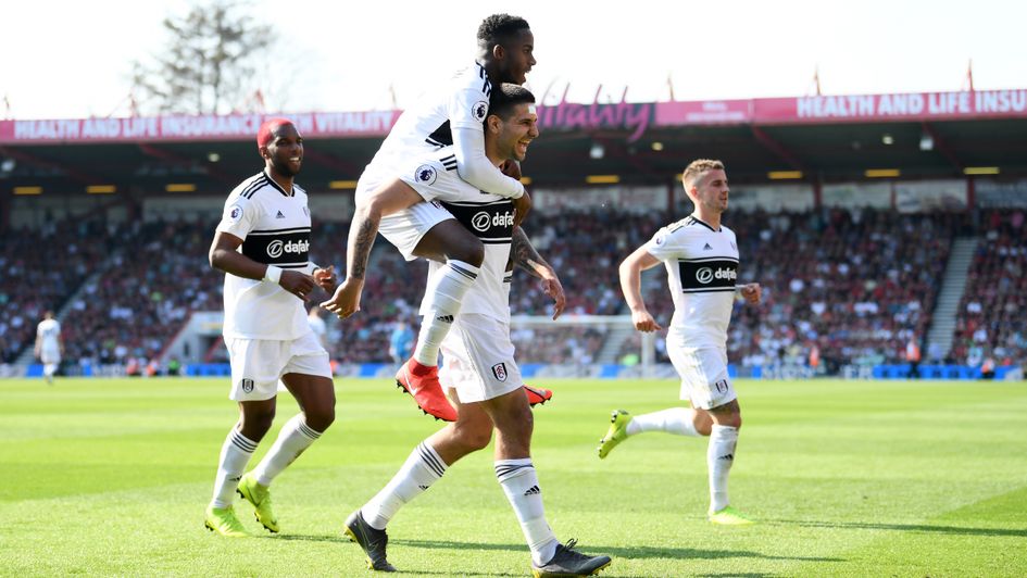 Fulham players celebrate Aleksandar Mitrovic's penalty at Bournemouth