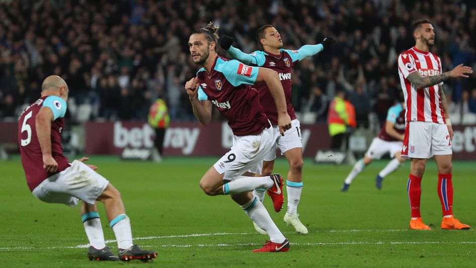 Andy Carroll runs to celebrate after his equaliser for West Ham against Stoke