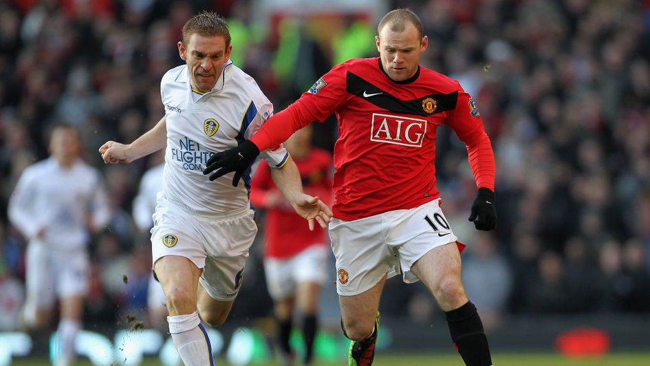 Richard Naylor battles against Wayne Rooney