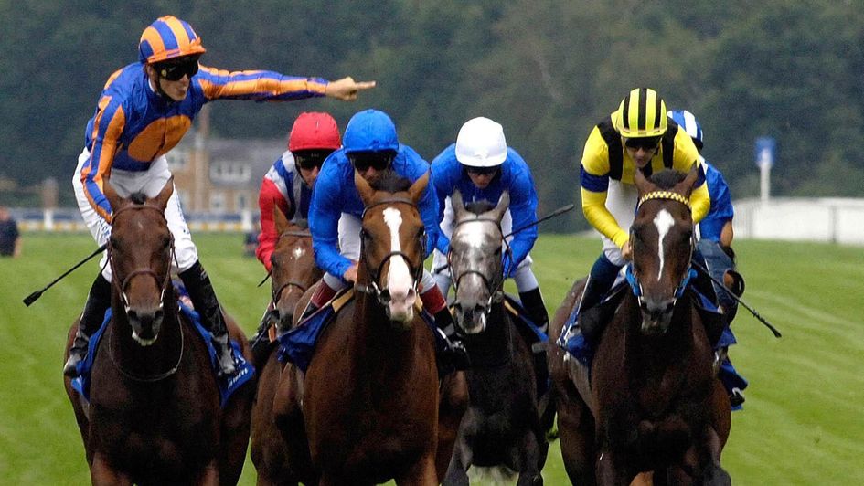 Christophe Soumillon celebrates on Hurricane Run