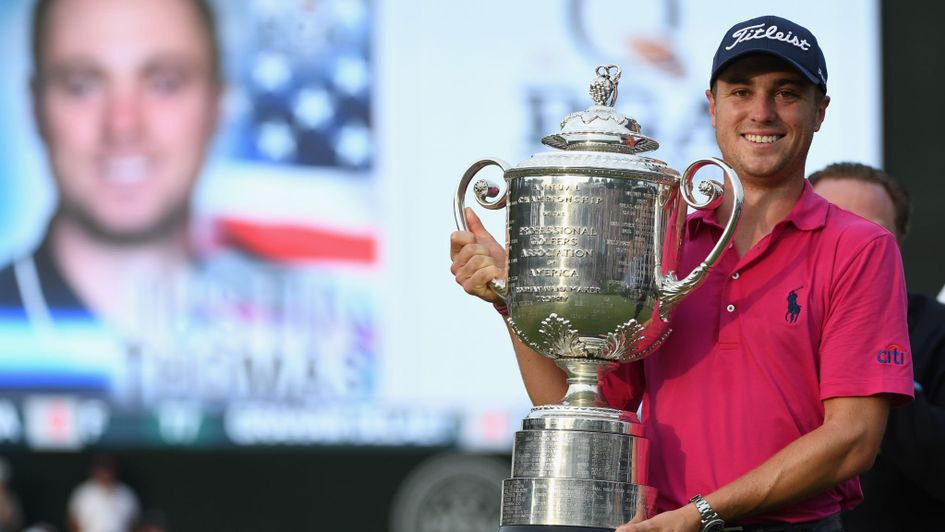 Justin Thomas poses with the Wanamaker Trophy