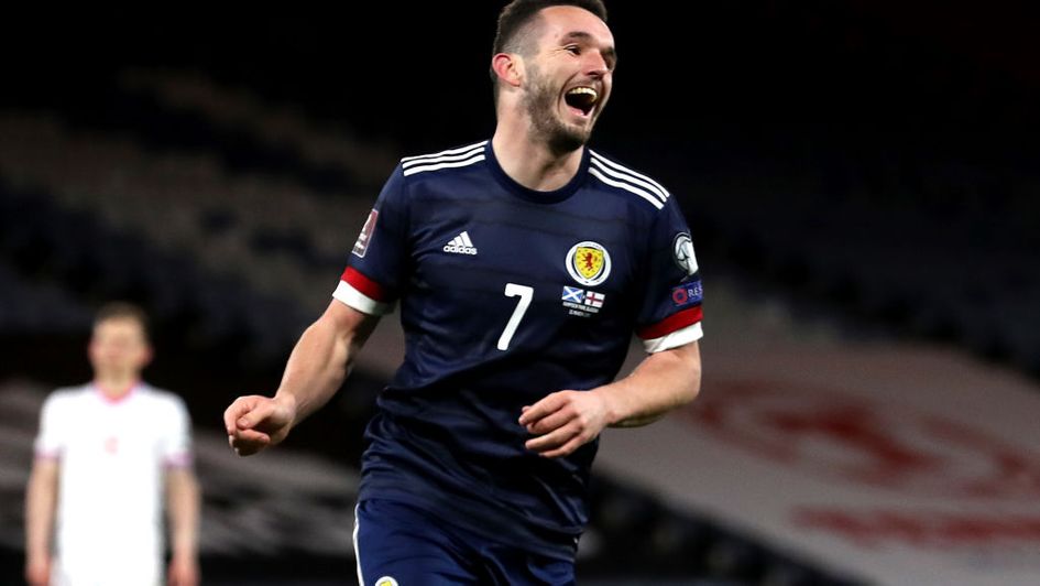 John McGinn starred while forward Che Adams opened his account for Scotland