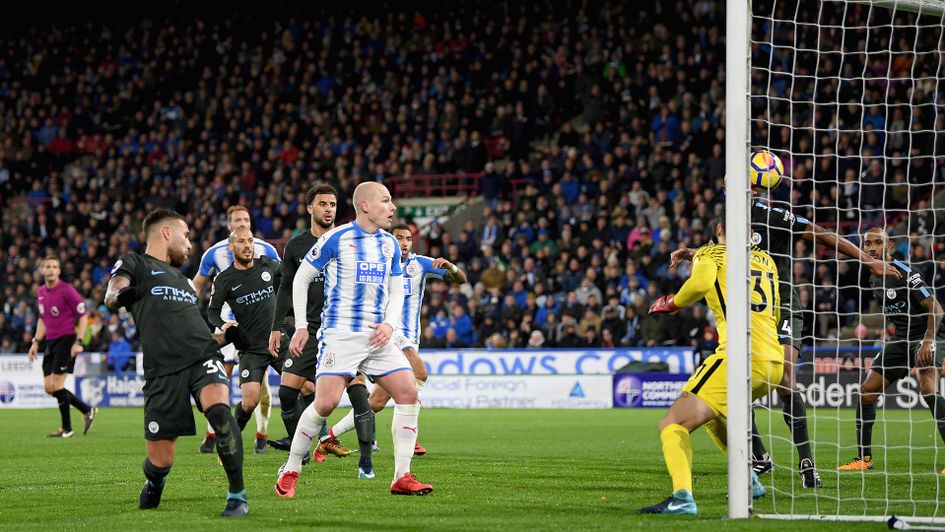 Nicolas Otamendi scores an own goal against Huddersfield