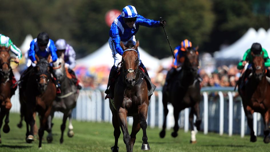 Jim Crowley celebrates on Battaash