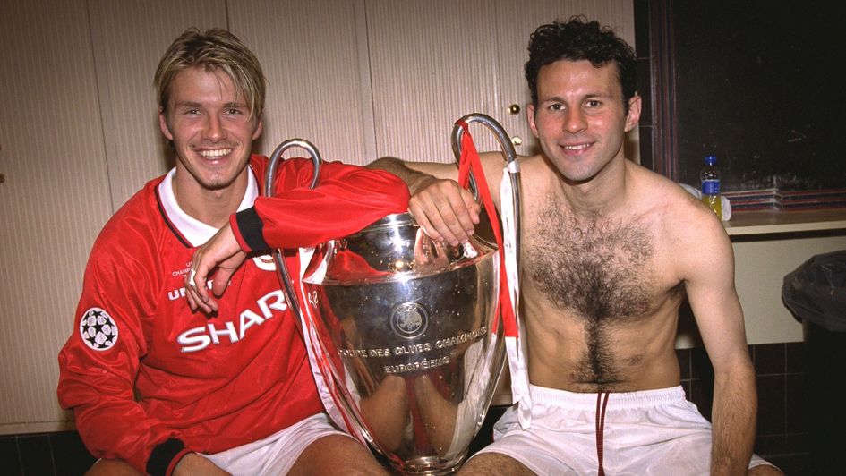 David Beckham and Ryan Giggs celebrate with the trophy