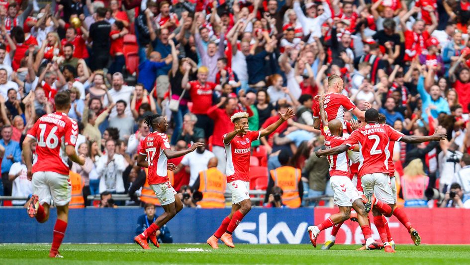 Charlton players and fans celebrate promotion