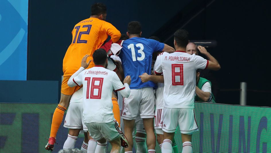 Iran players celebrate their late World Cup winner v Morocco