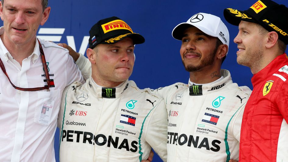 Valtteri Bottas (L) and Lewis Hamilton after coming second and and first respectively in Russia