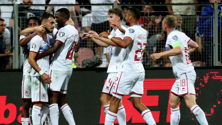 Luxembourg celebrate a goal in their 2-0 win in Bosnia and Herzegovina