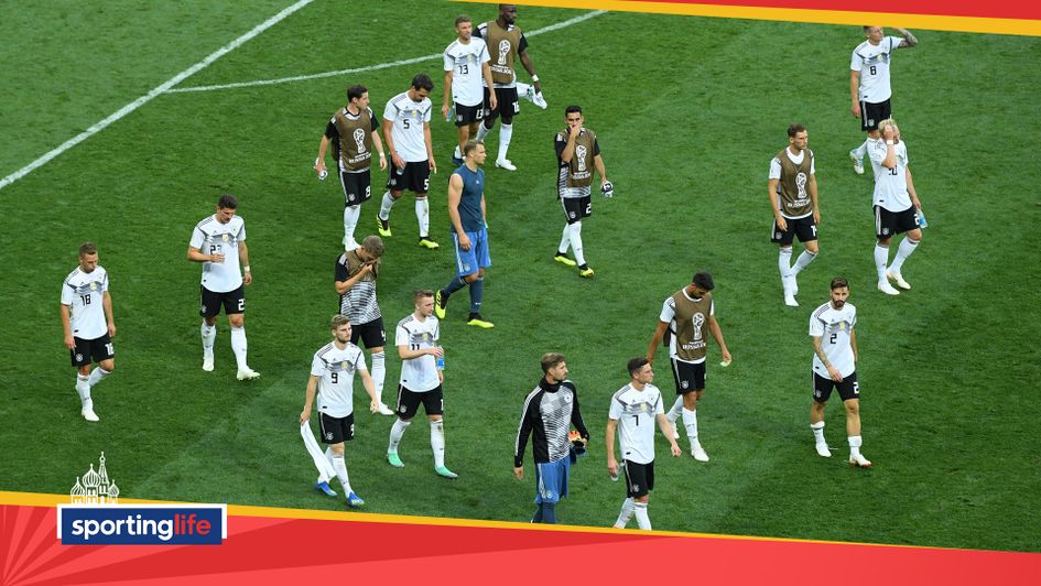 Dejected: Germany's players at the final whistle after defeat to Mexico