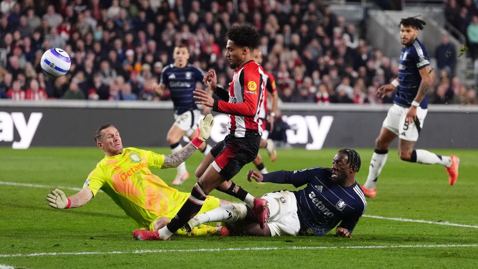 Axel Disasi blocks a shot