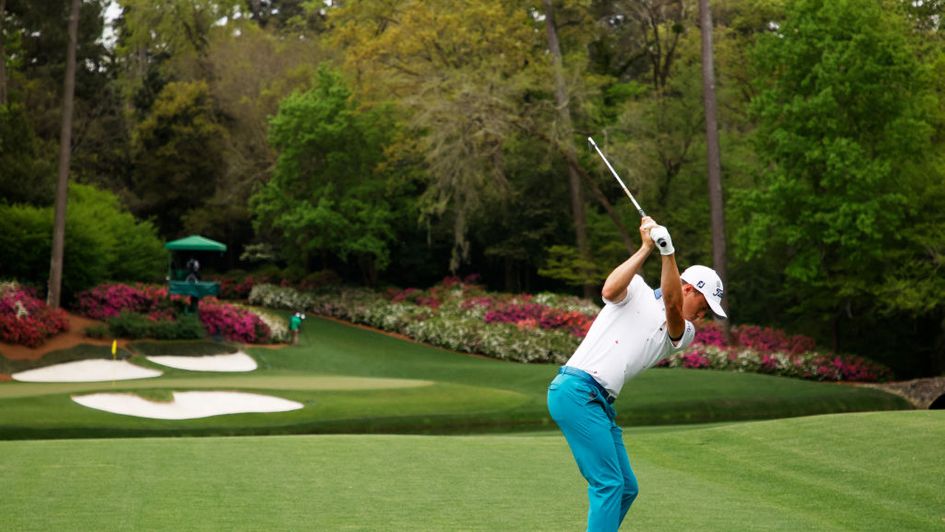 Justin Thomas hits an approach to the 12th hole