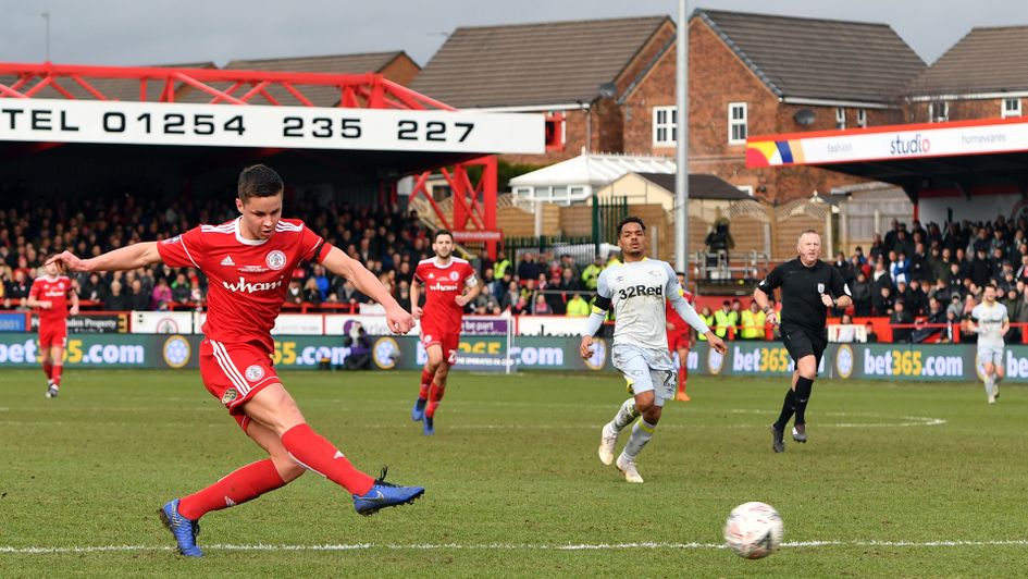 Callum Johnson has an effort on goal in Accrington's clash with Derby