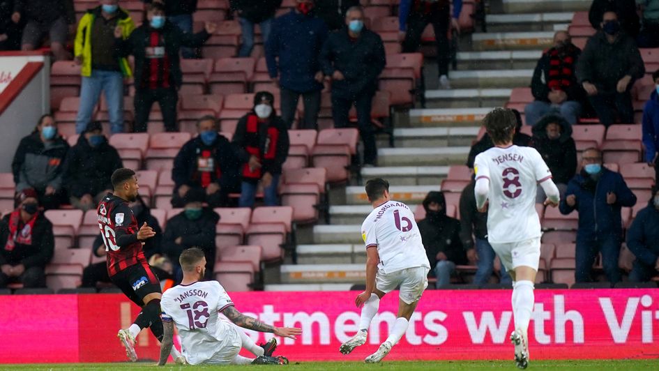 Bournemouth's Arnaut Danjuma (left) scores the winning goal