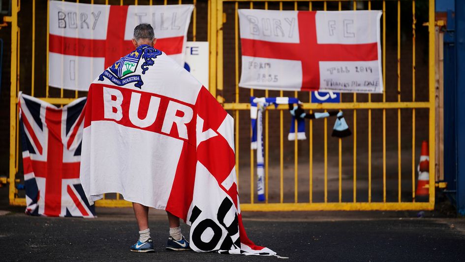 A Bury supporter outside Gigg Lane