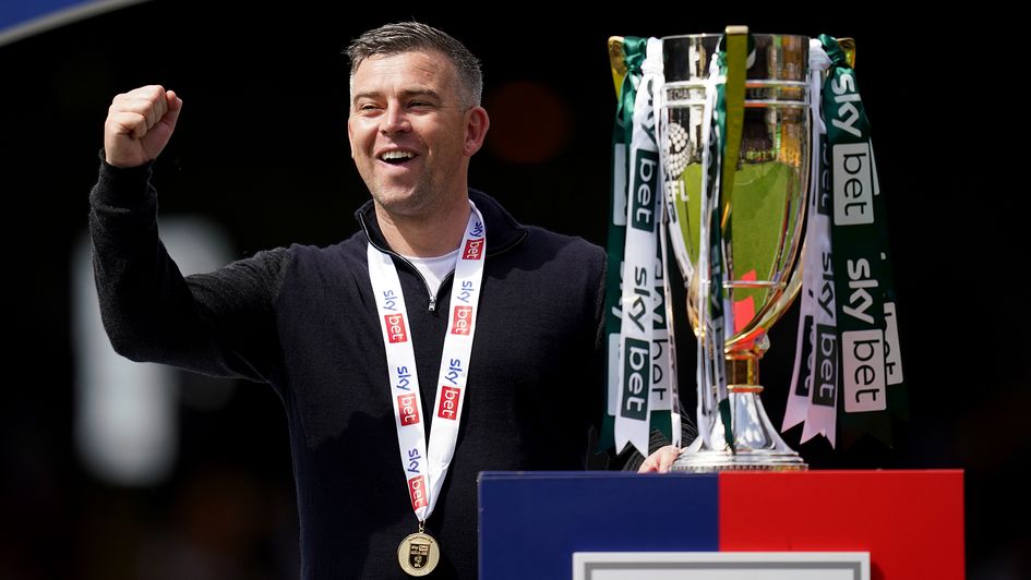 Plymouth boss Steven Schumacher with the Sky Bet League One trophy