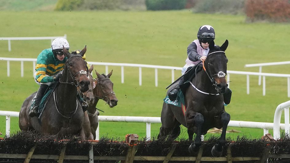 Look To The West (right) ridden by Rachael Blackmore clears the last