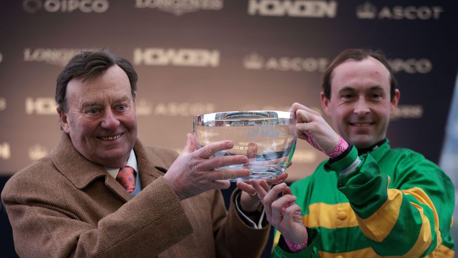 Nicky Henderson and Nico de Boinville lift the Clarence House trophy