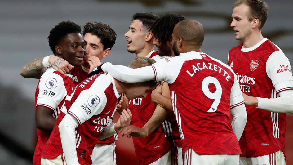 Arsenal celebrate Bukayo Saka's strike during their victory over Chelsea