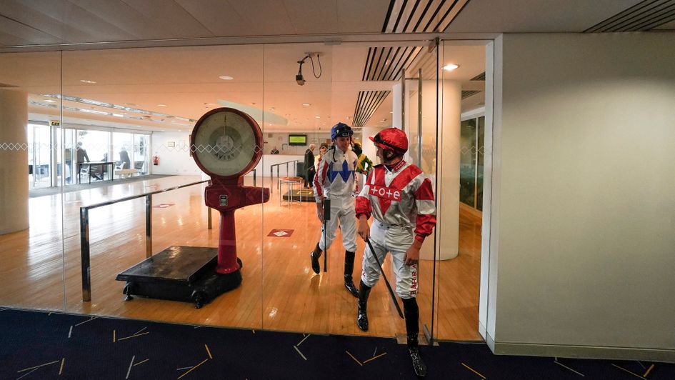Jockeys leave the weighing room at Epsom