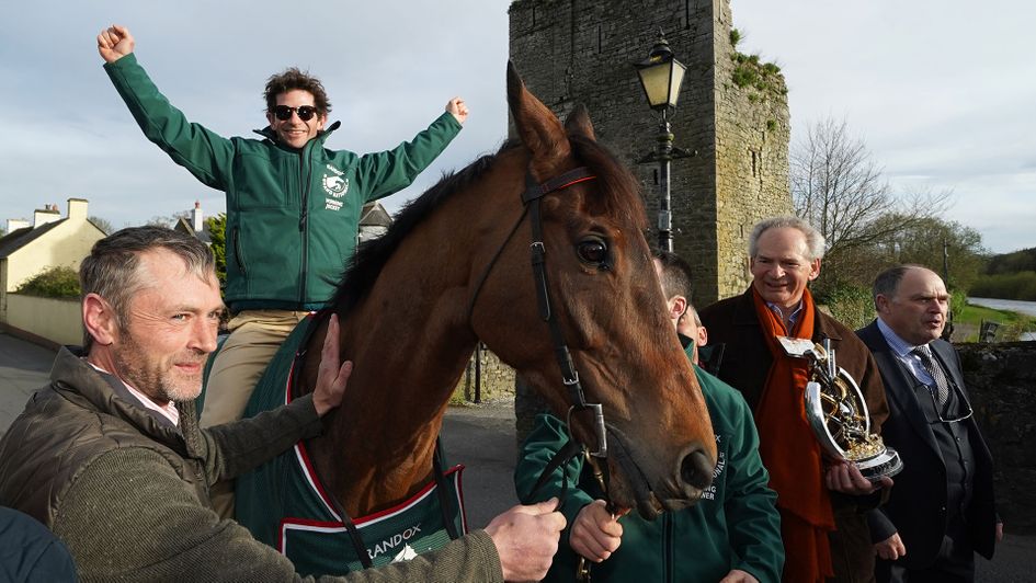 Sam Waley-Cohen on board Noble Yeats pose for photos outside the Lord Bagenal Inn during their homecoming parade in County Carlow