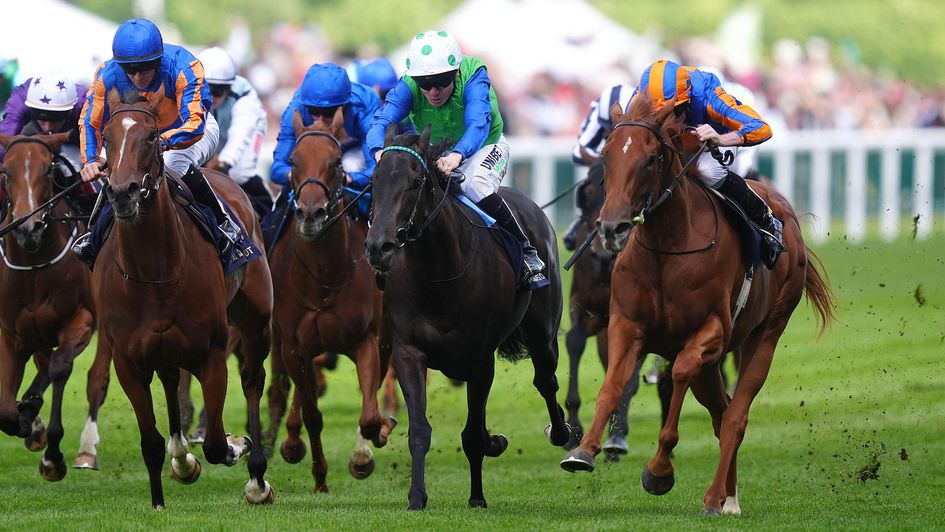 Fairy Godmother (right), ridden by Ryan Moore, wins at Ascot