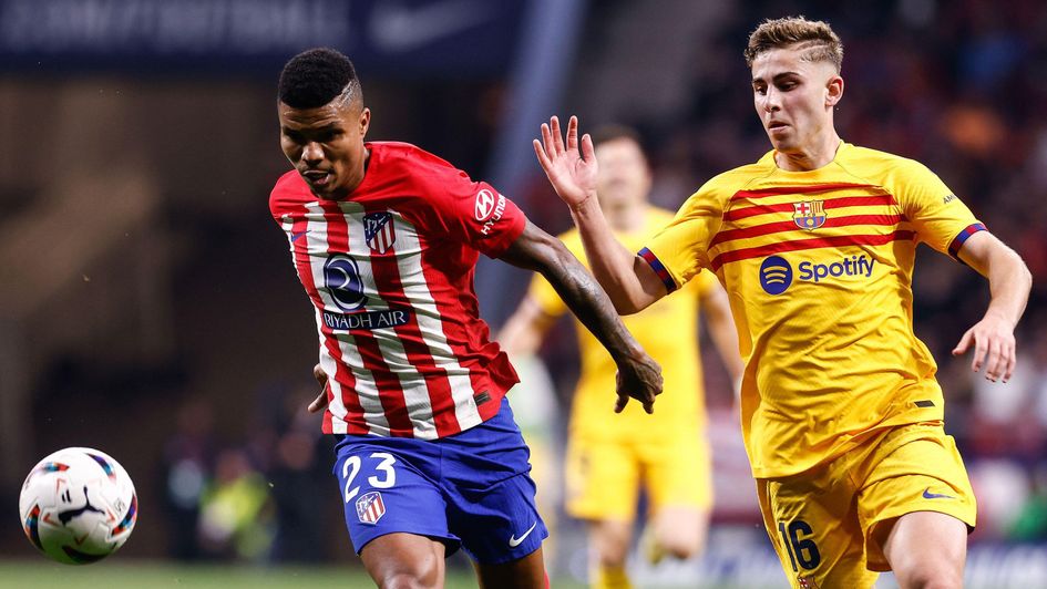 Reinildo Mandava of Atletico de Madrid and Fermin Lopez of FC Barcelona