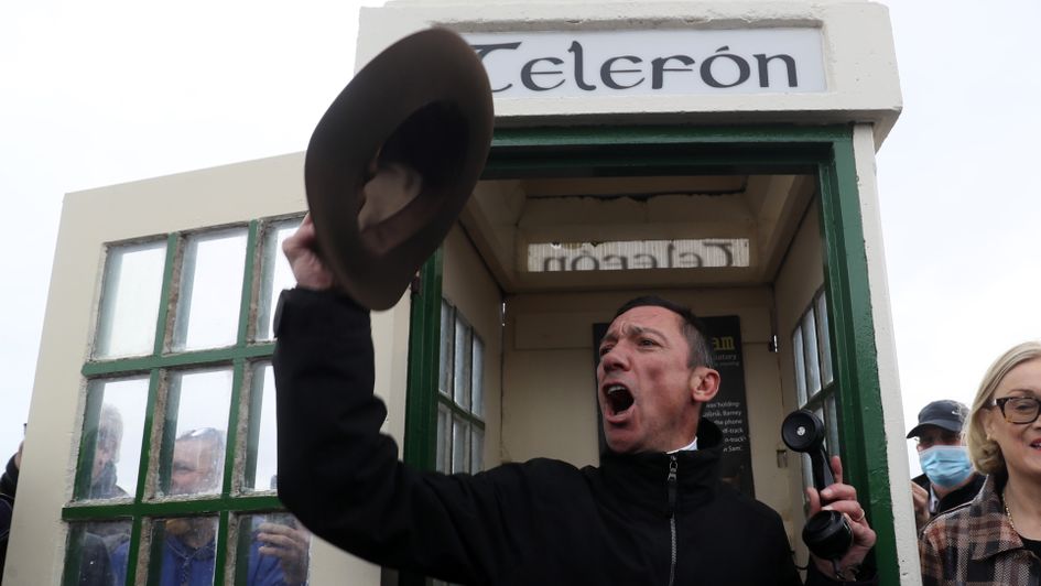 Frankie Dettori poses in the infamous Black Sam telephone box at Bellewstown racecourse