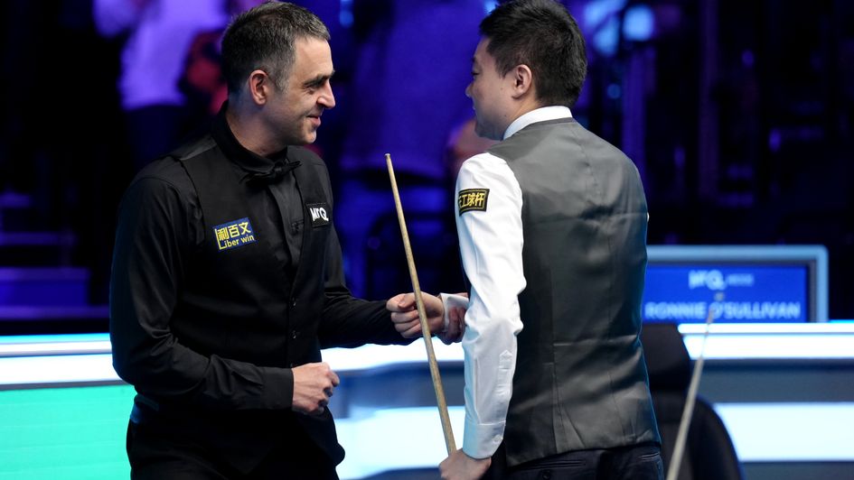 Ding Junhui and Ronnie O'Sullivan embrace after his 147 maximum break at Ally Pally