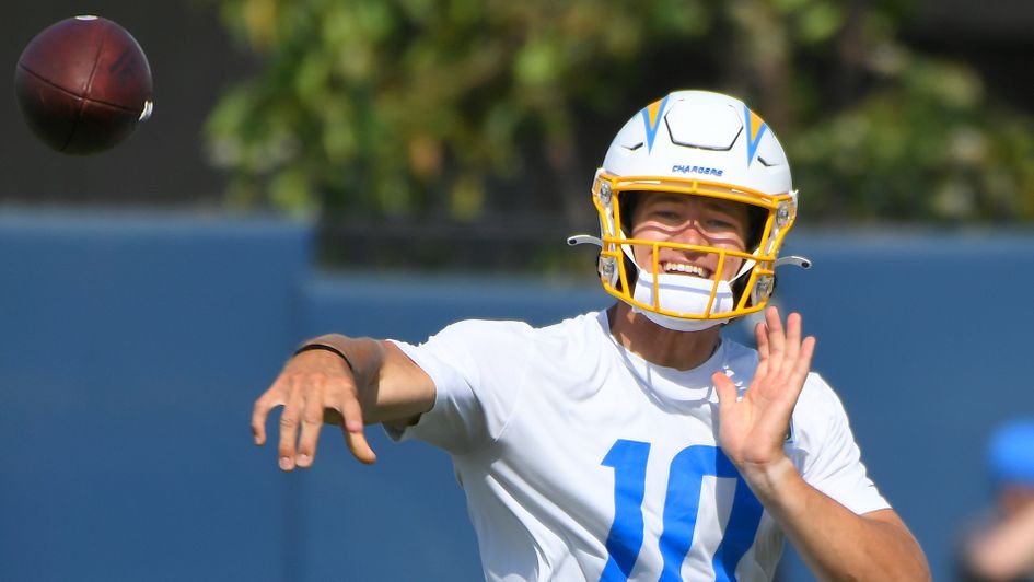 Justin Herbert throws the ball during mandatory minicamp